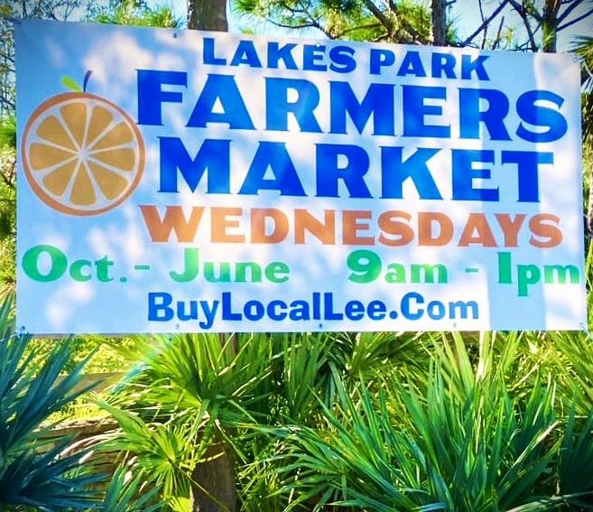 A sign for the lakes park farmers market