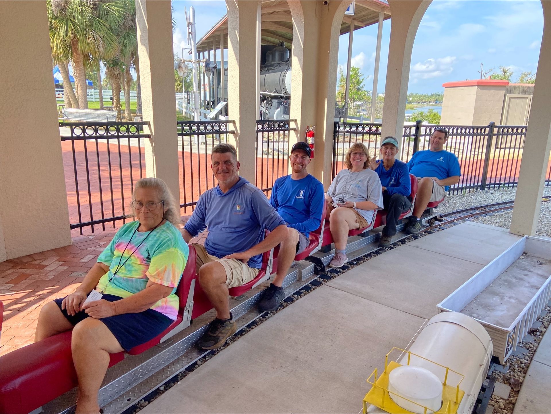 A group of people are sitting on a train.