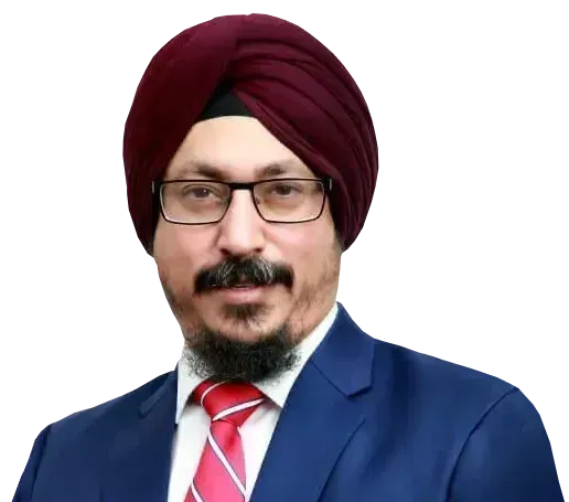 A person wearing a maroon turban, glasses, a blue suit, and a red-and-white striped tie against a white background.