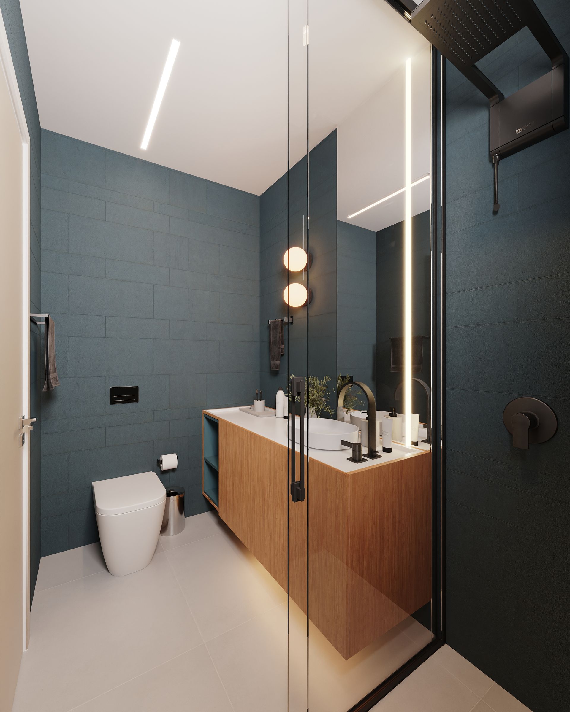 Um banheiro com um vaso sanitário, uma pia e um espelho