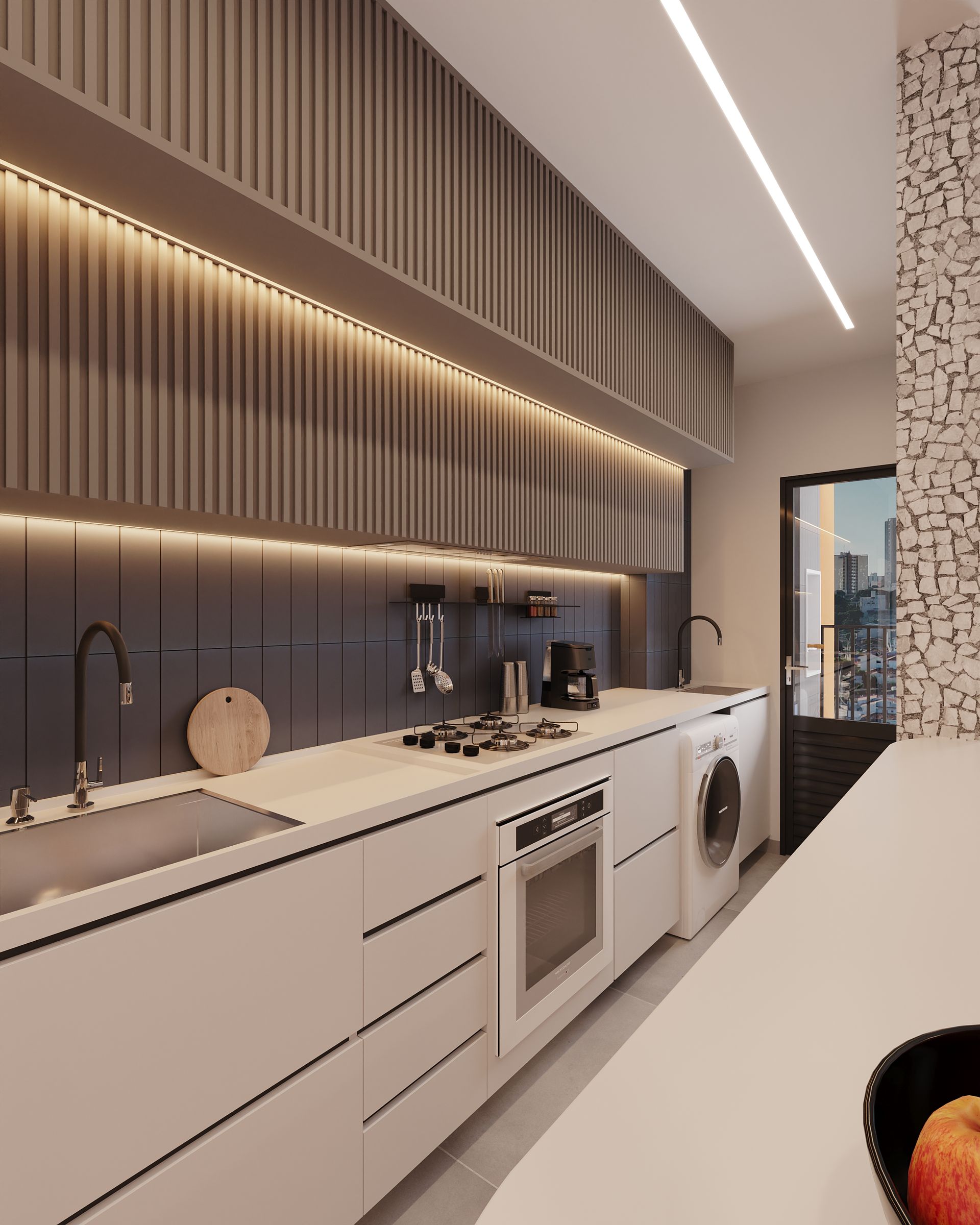 Uma cozinha com uma tigela de maçãs no balcão