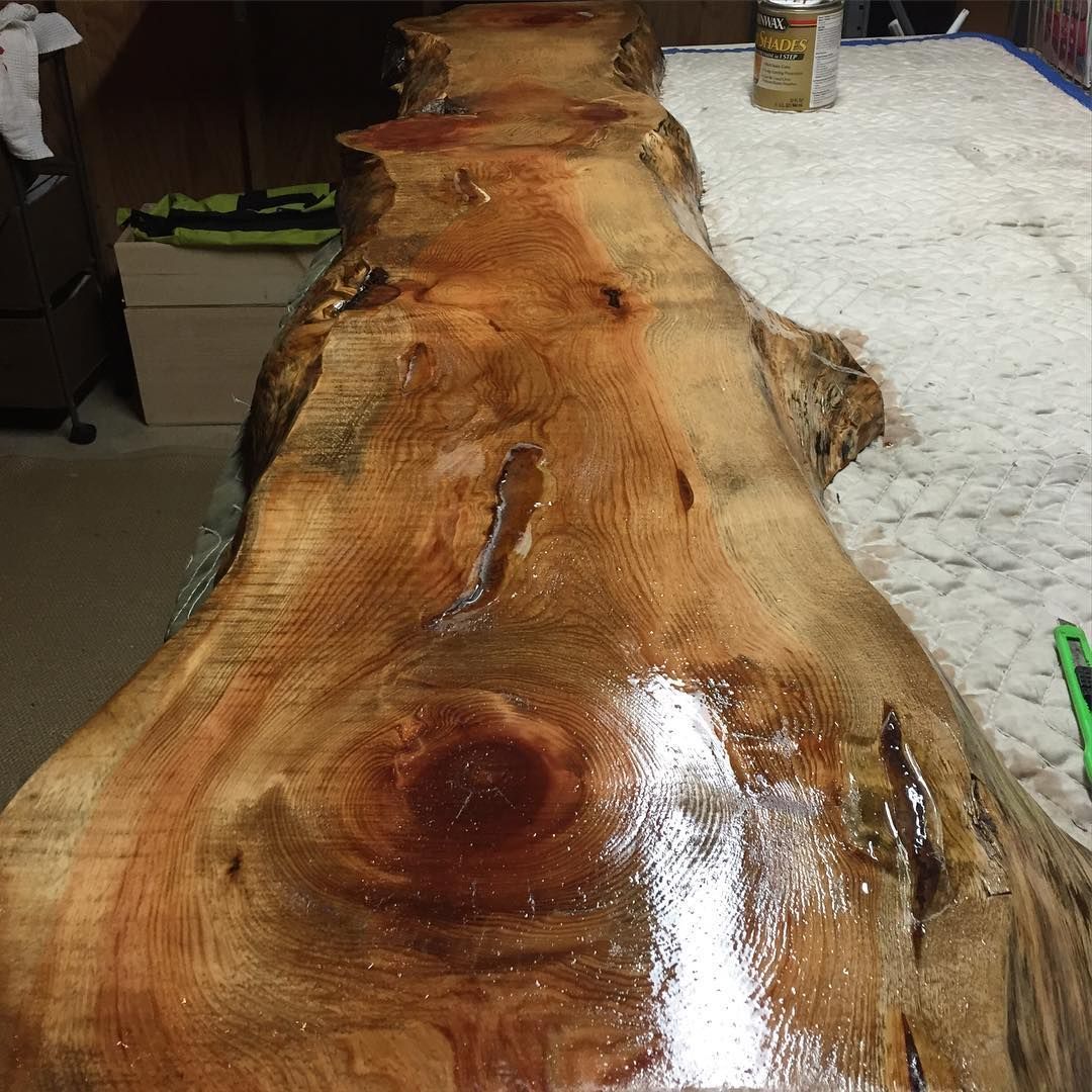 A large piece of wood is sitting on top of a table.