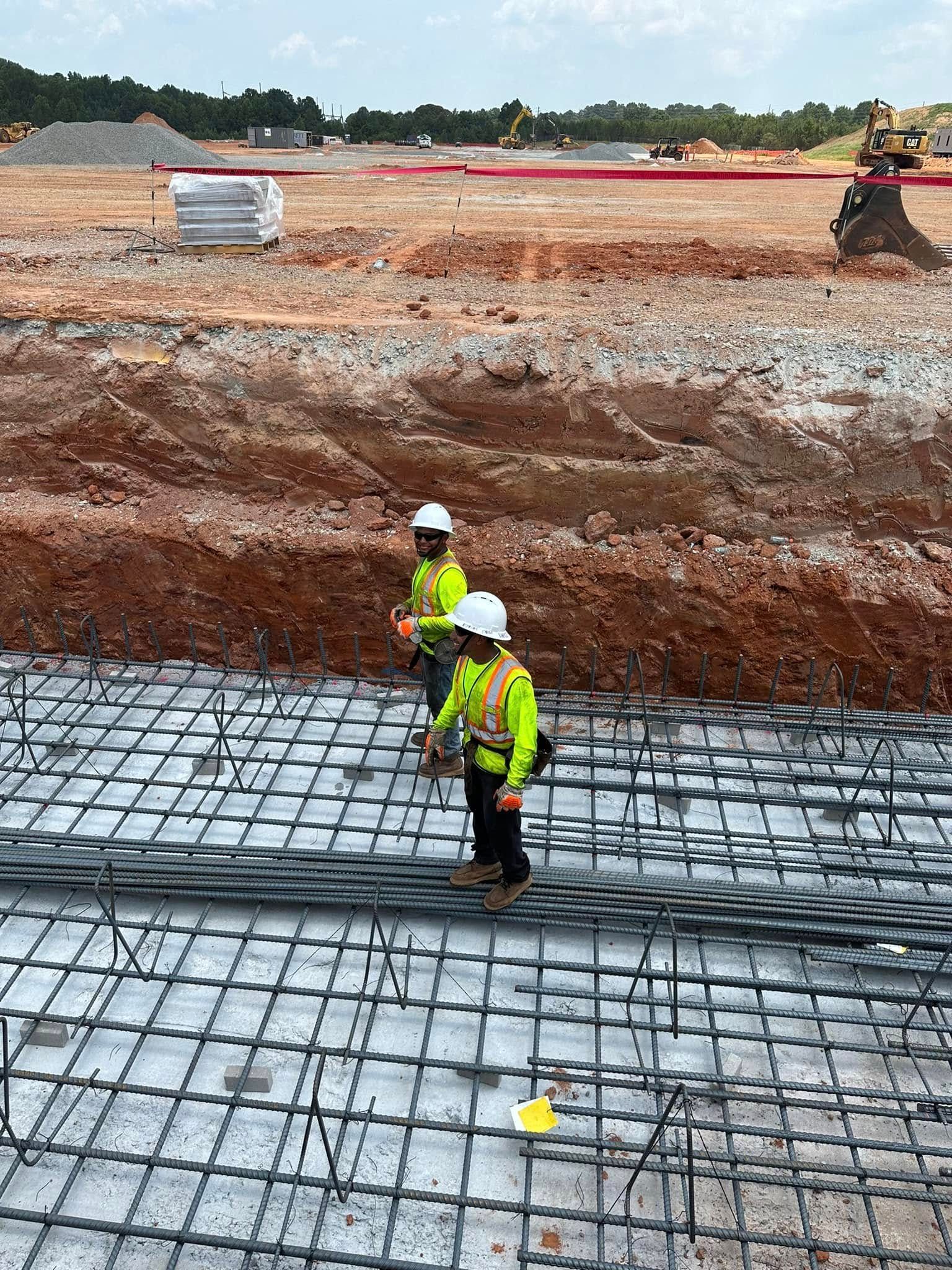 excavator grading a commercial lot
