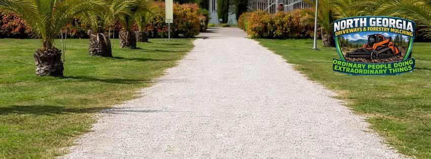 Gravel path through a landscaped lawn with palm trees and a North Georgia sign on the right