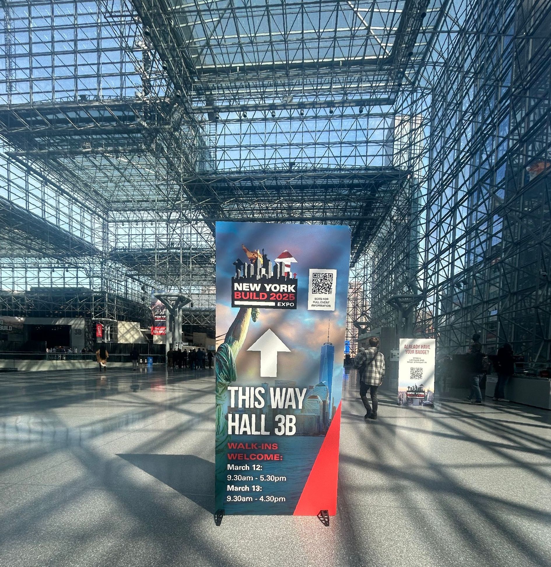NY Javis Center - Steel Structure and a poster about the NY Build Expo 2025