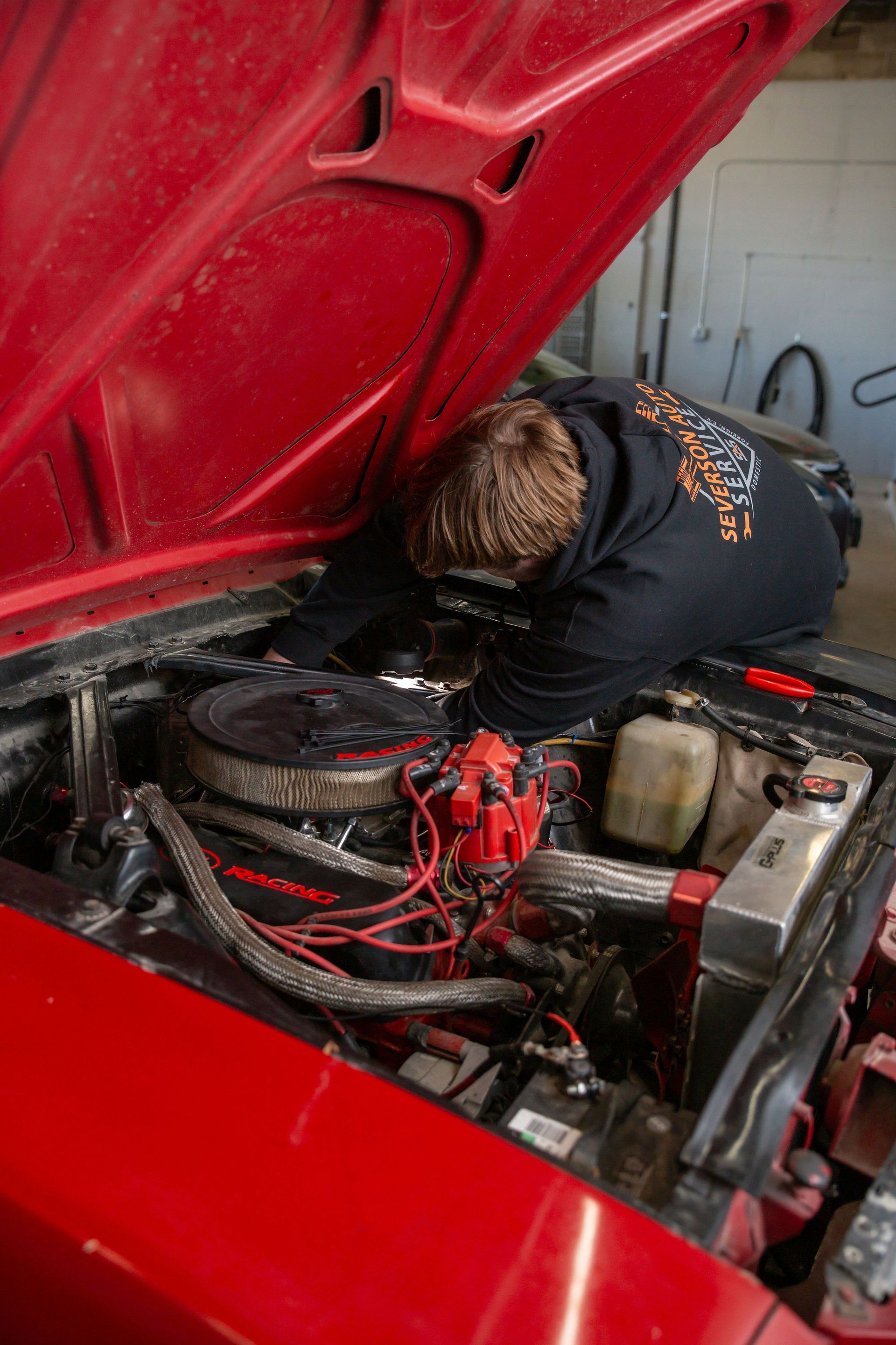 Brady working on an old car | Severson Auto Service