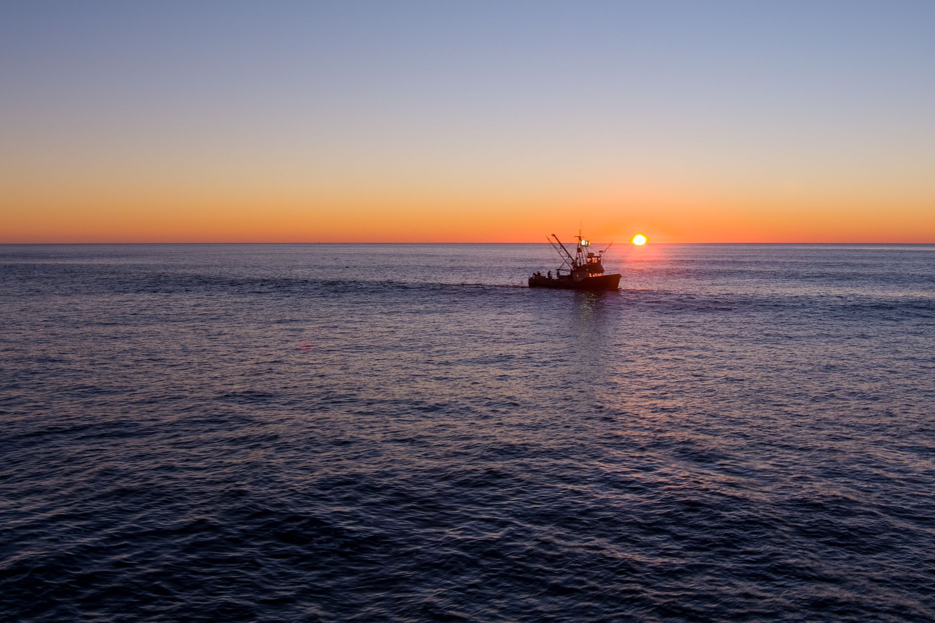 ocean-view-with-sunset-and-boat