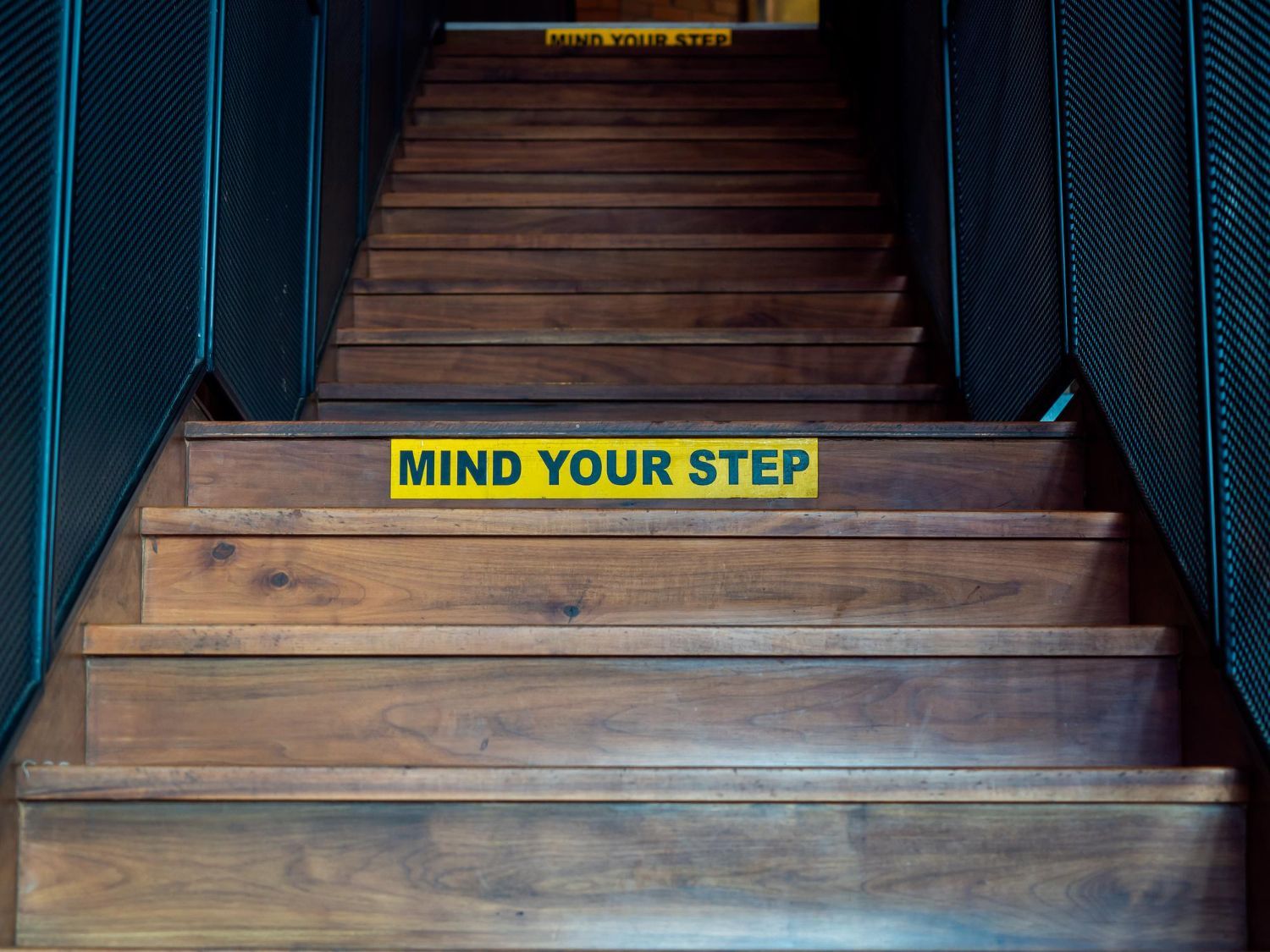 Wooden staircase with yellow