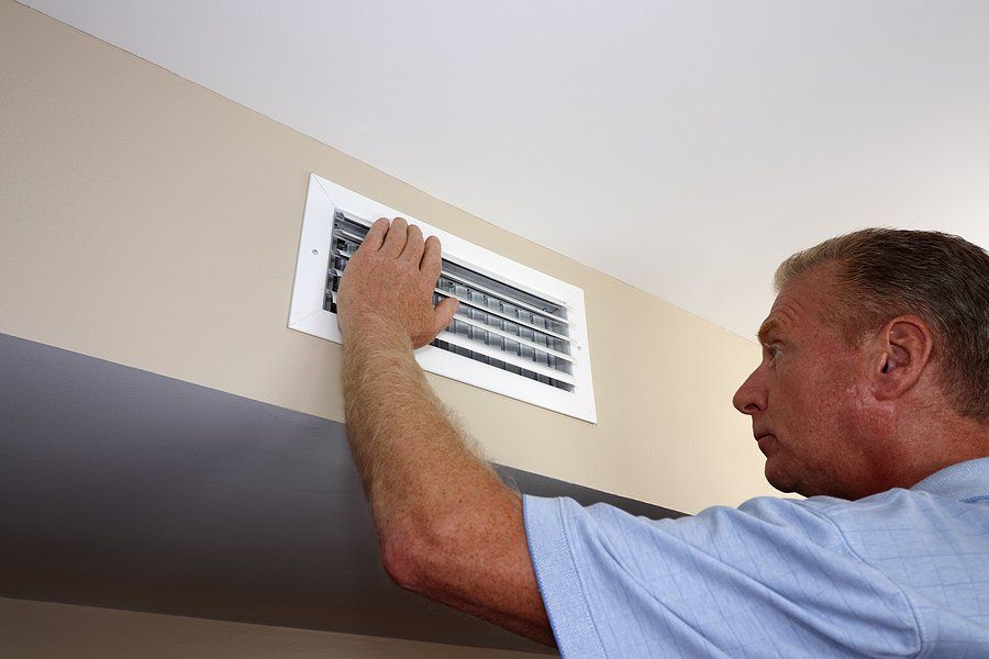 man checking the vents