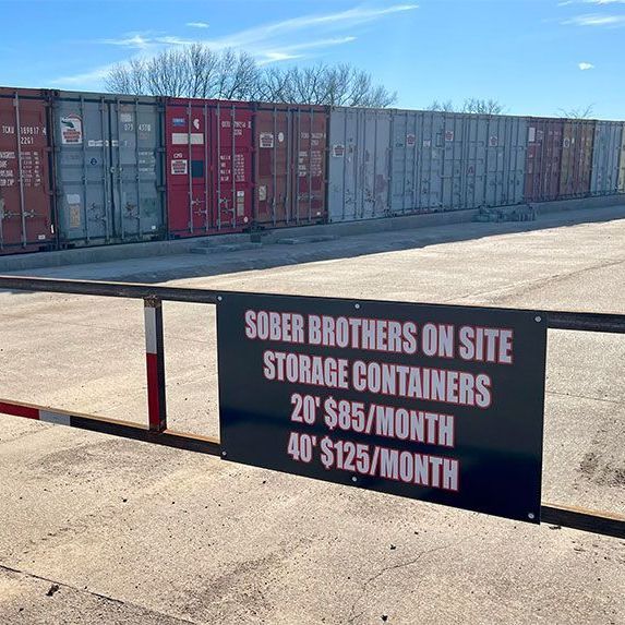 A sign that says sober brothers on site storage containers 20 ' $ 85 / month 40 ' $ 125 / month