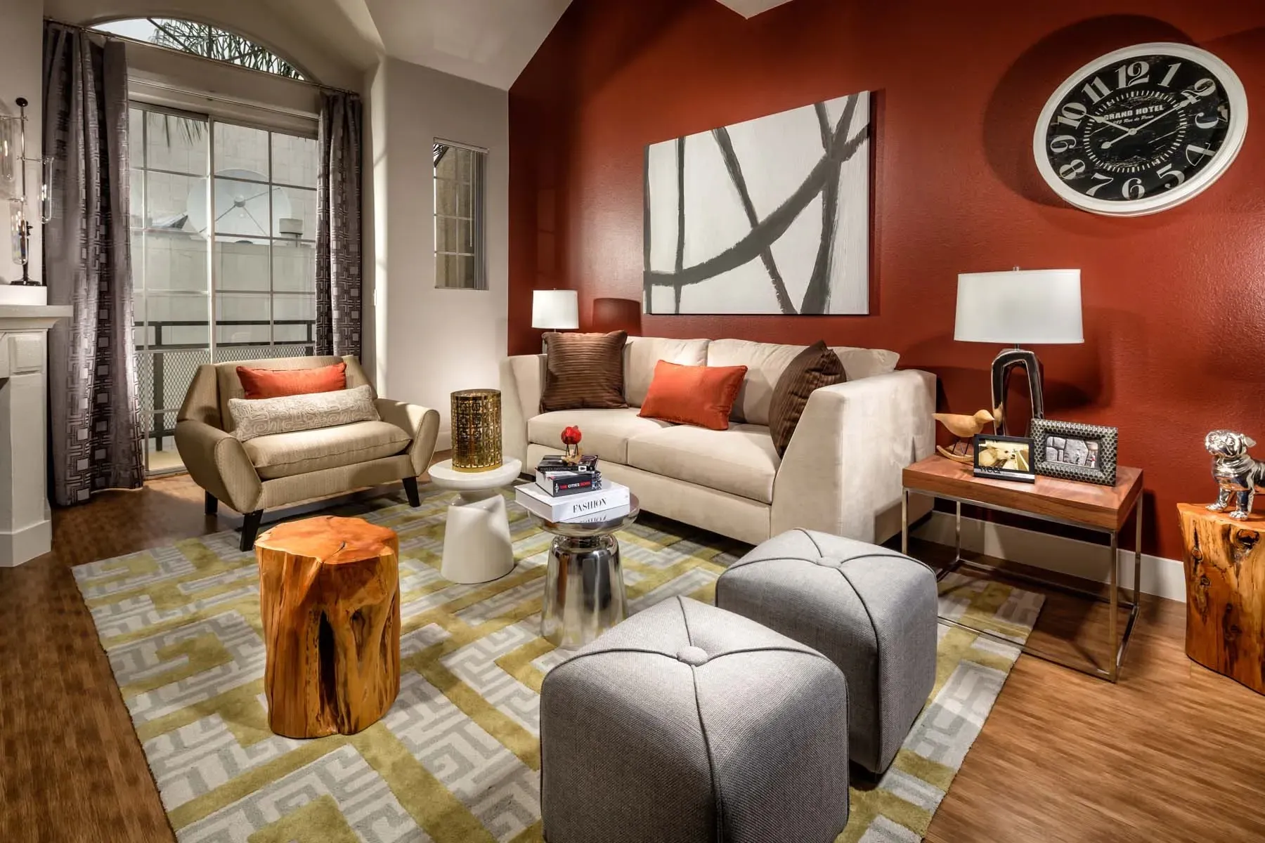 Living room with a couch, accent chairs, ottoman, and coffee table.