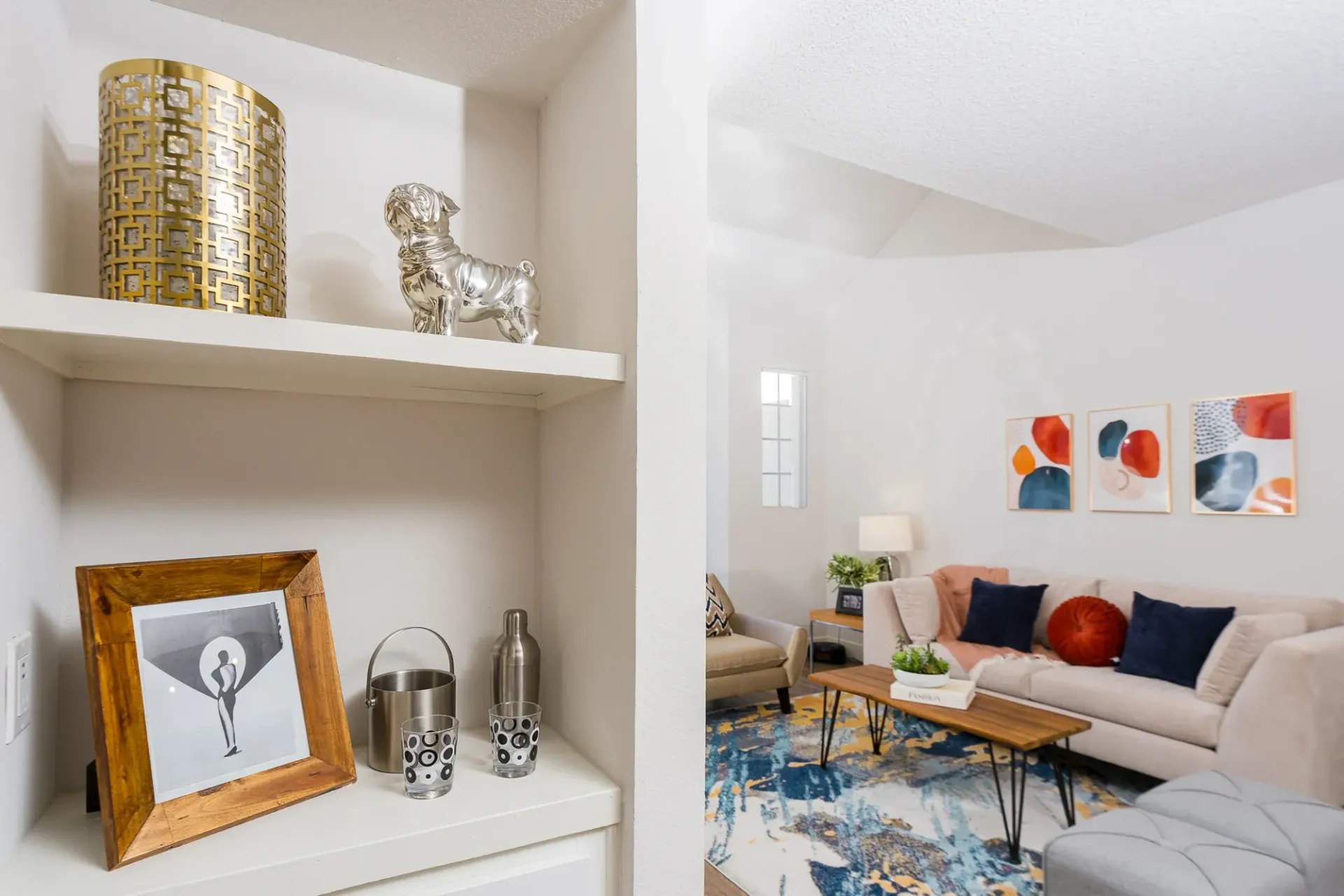 Stylish living room with a plush sofa, modern coffee table, and abstract art.
