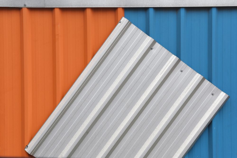 A Close Up of a Blue and Orange Metal Roof — HTH Sheetmetal Mackay in Mackay, QLD