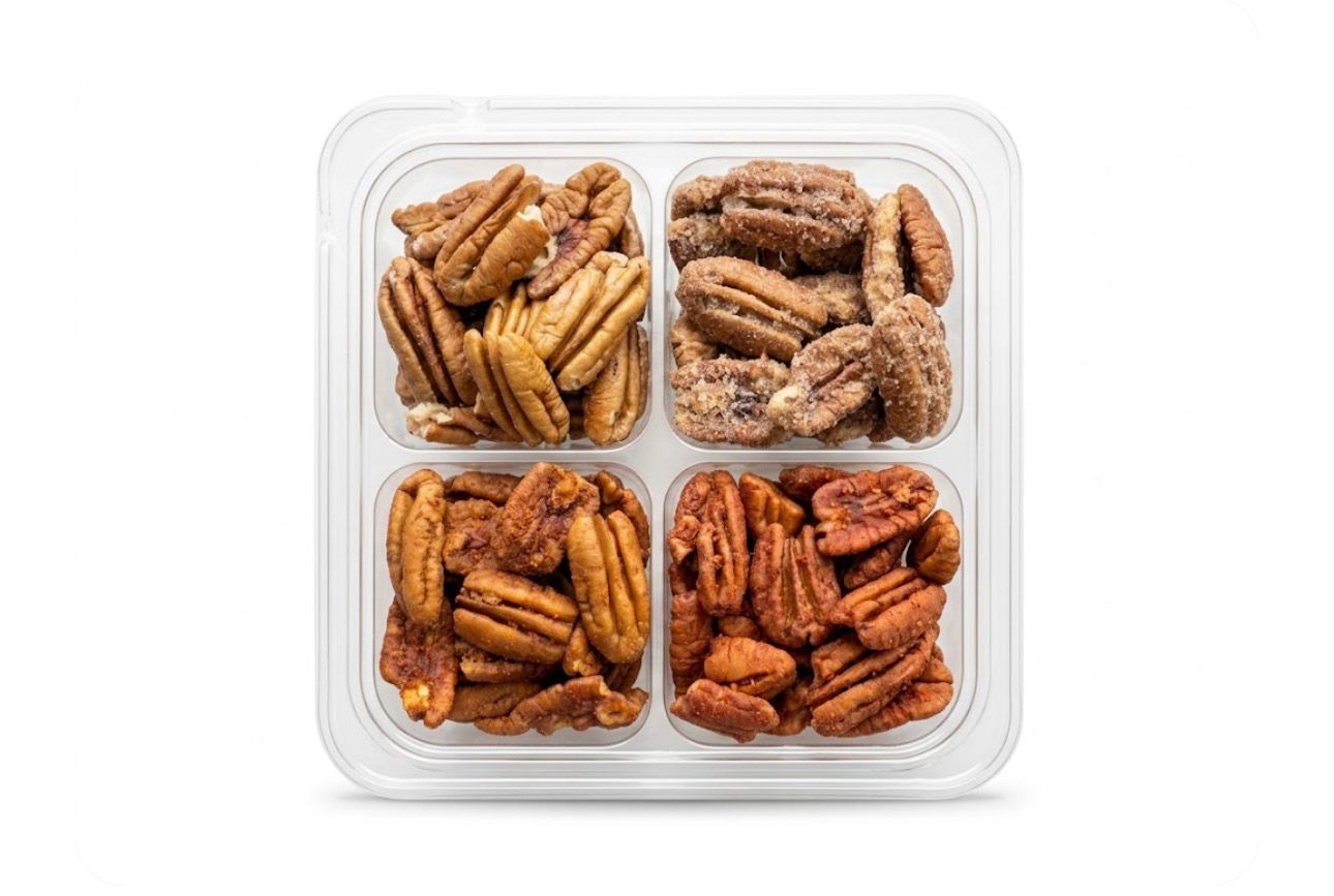 Assorted assorted Christmas cookies in a clear plastic tray with a holiday label in the center.