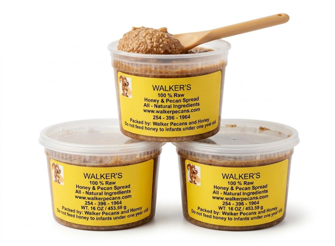 Three clear plastic tubs of Walker's haggis, with one open tub and a wooden spoon on top.