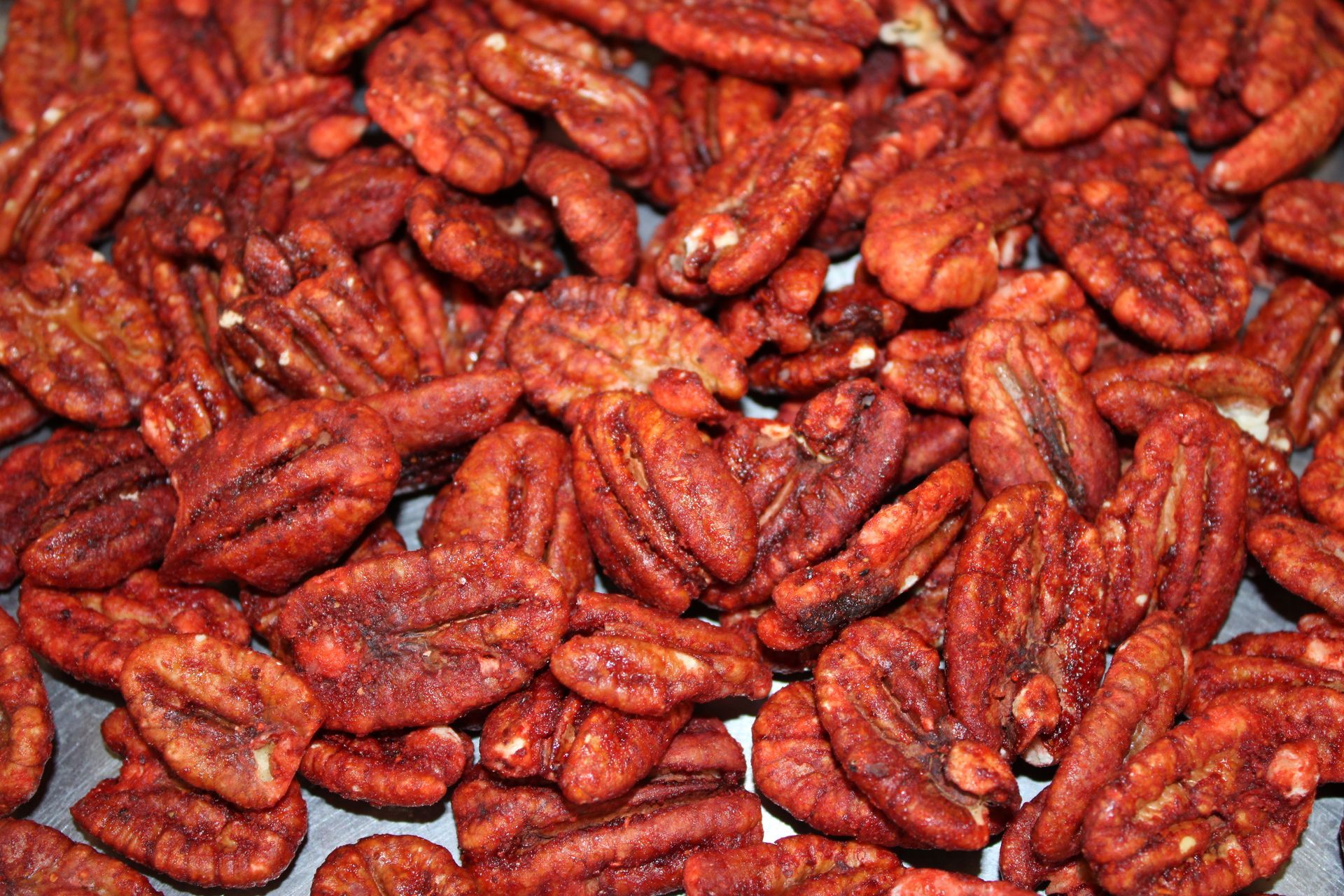 Pile of reddish-brown dried chilies filling the frame