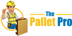A man in a hard hat is holding a wooden pallet and giving a thumbs up.