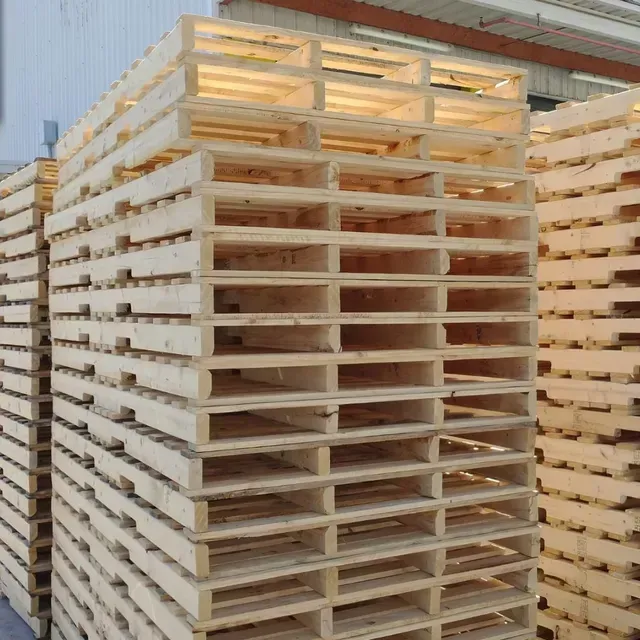 A bunch of wooden pallets are stacked on top of each other
