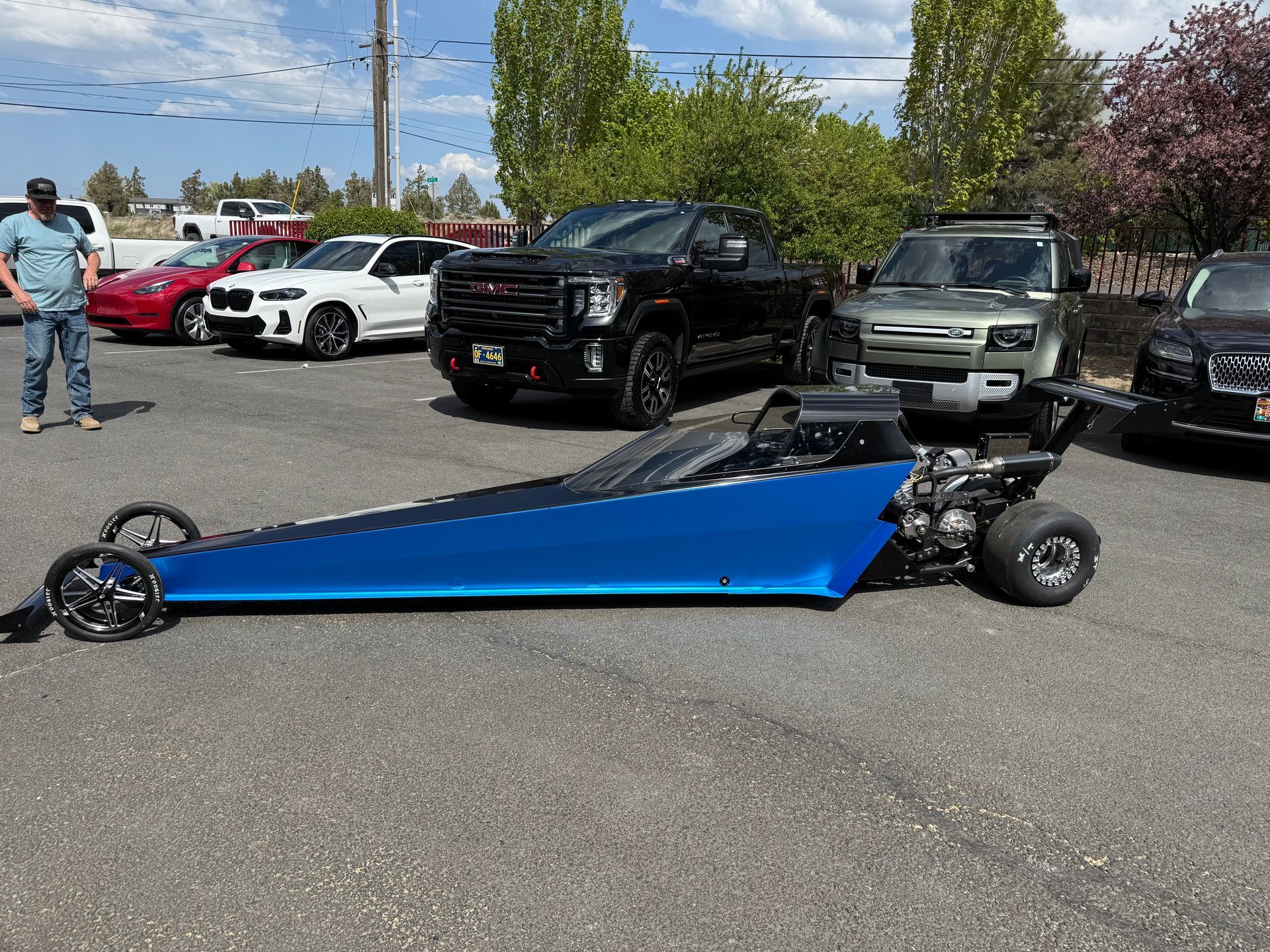 A black tire cover is sitting on top of a tire.