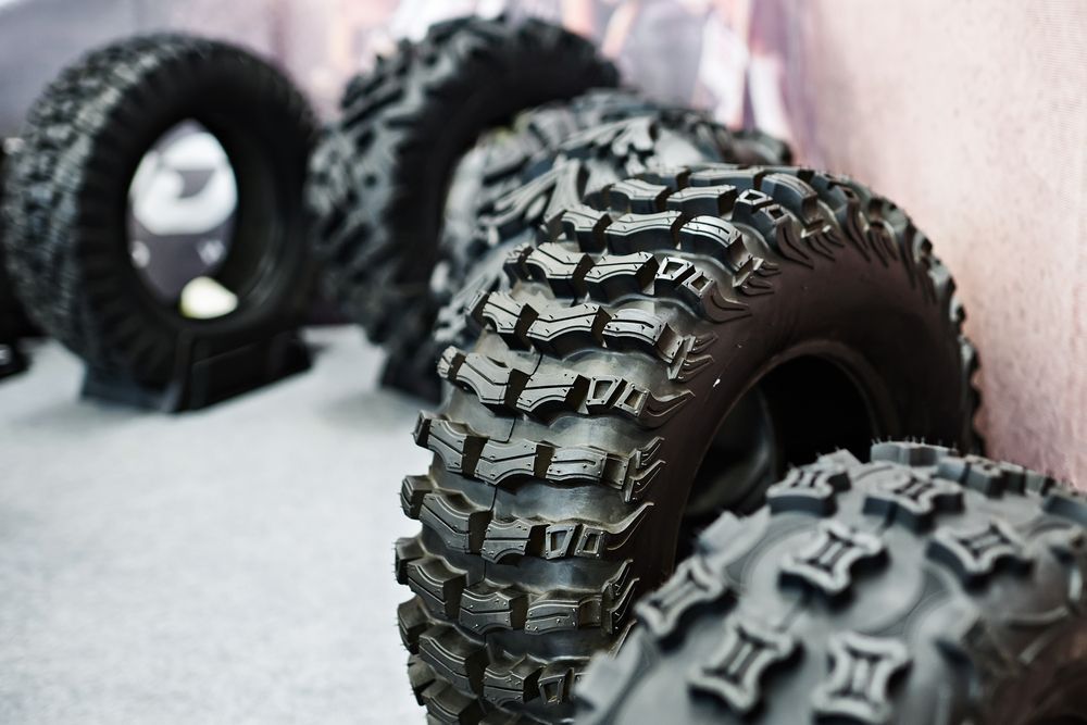 Several Black All-terrain Tires With Deep, Aggressive Treads — THG Tires in Gladstone Central, QLD