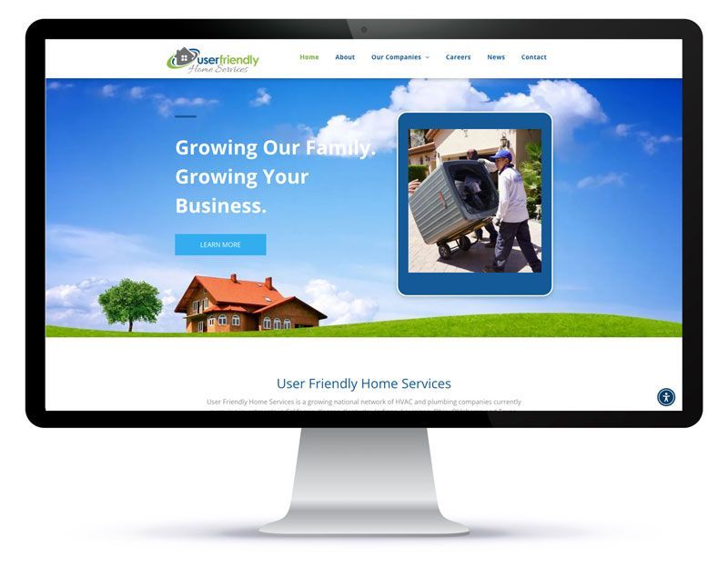 A computer monitor is displaying a website for a moving company.