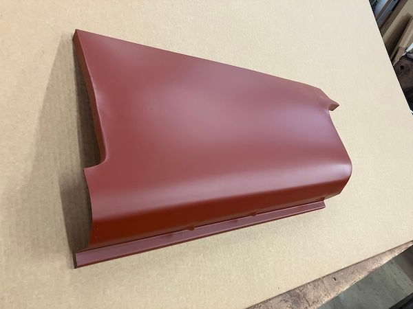 Red metal car body panel; right side, showing edge details.