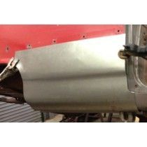 A metal car panel is being installed on a red vehicle in an industrial setting.