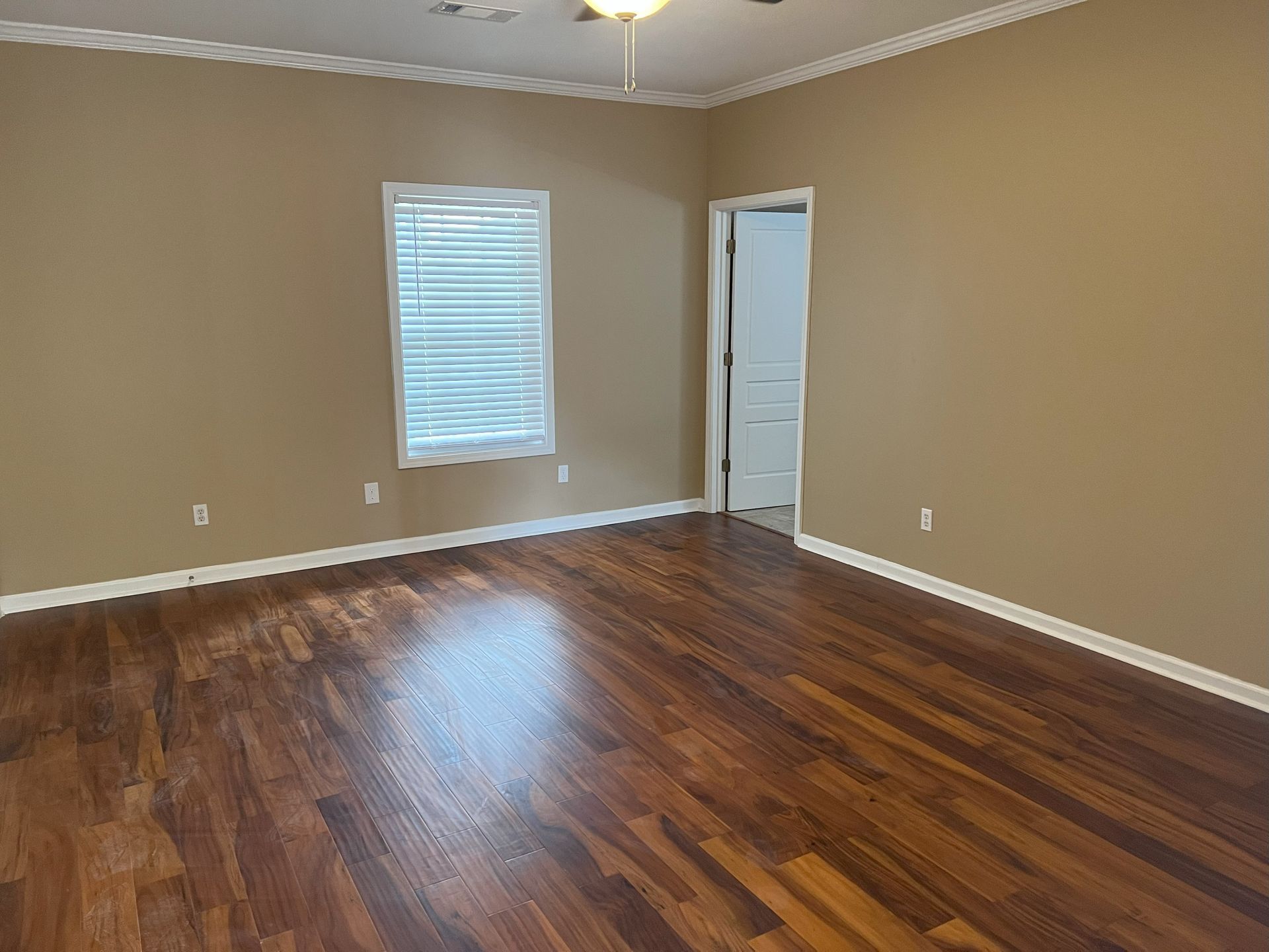 Showcase of WP Home Repair job - hardwood floors and a window.