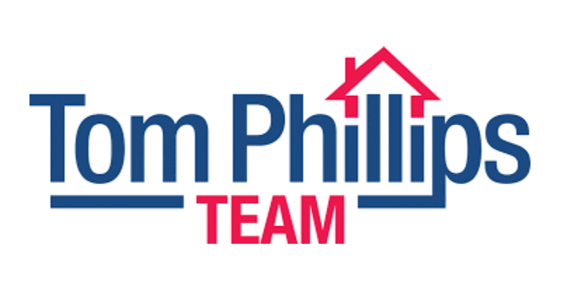 The logo reads "Tom Phillips TEAM" in blue and red text with a stylized red house icon above the word "Phillips."