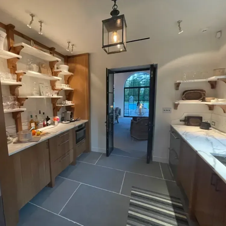 A kitchen with a lantern hanging from the ceiling