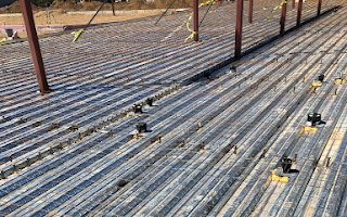 A roof with a lot of metal rods on it