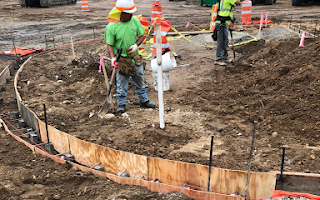 A group of construction workers are working on a construction site.