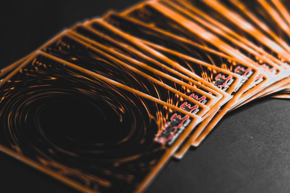 Orange light streaks forming a curved abstract pattern on a dark background