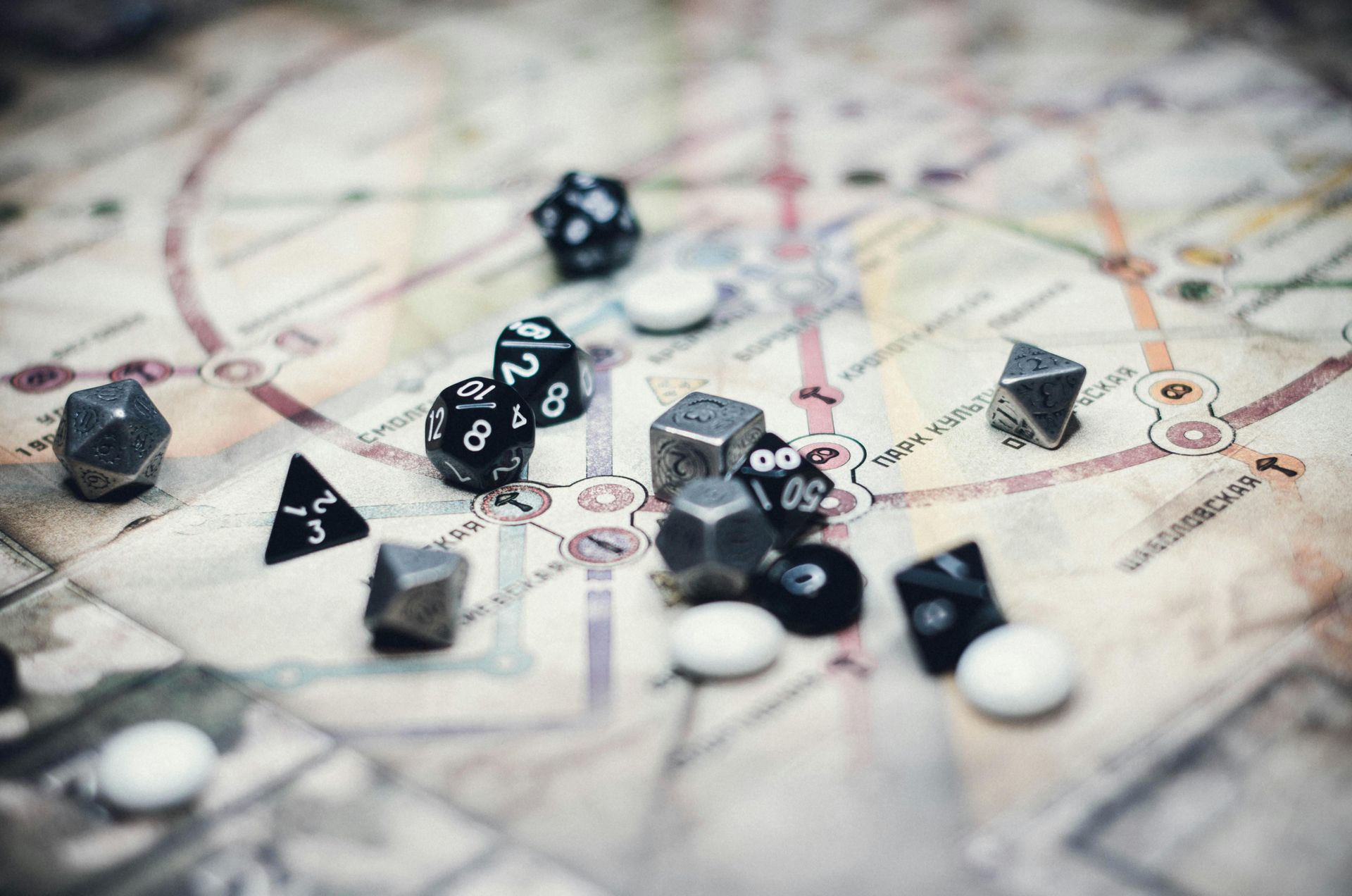 Dice scattered on a map, suggesting a tabletop role-playing game setup