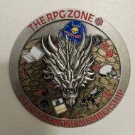 The RPG Zone membership badge with a silver dragon, blue hooded figure, and red text