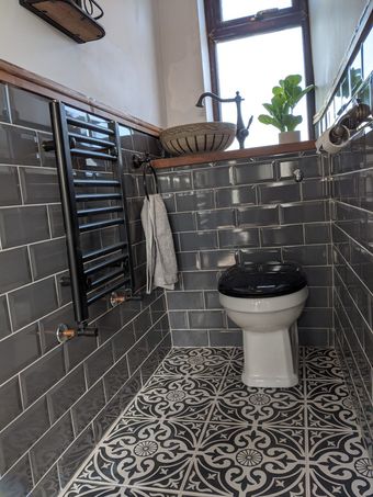 Cloakroom WC with vessel basin, grey metro tiles and patterned floor