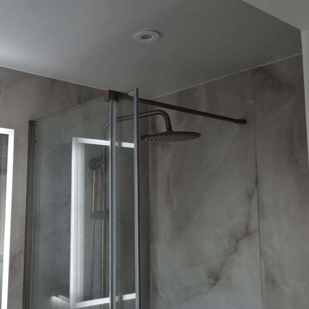 En-suite with LED mirror and marble-effect walk-in shower