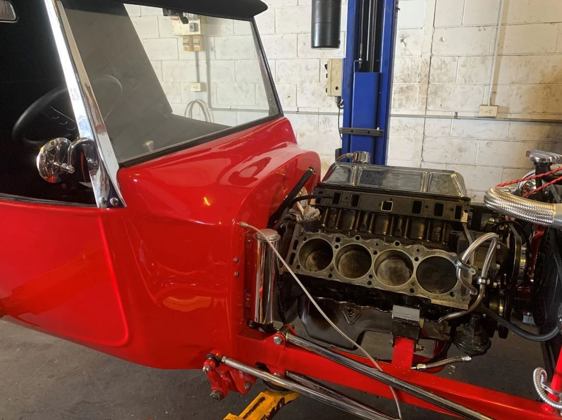 A Red Car Featuring a Compact Engine Located in The Rear Ballina, NS