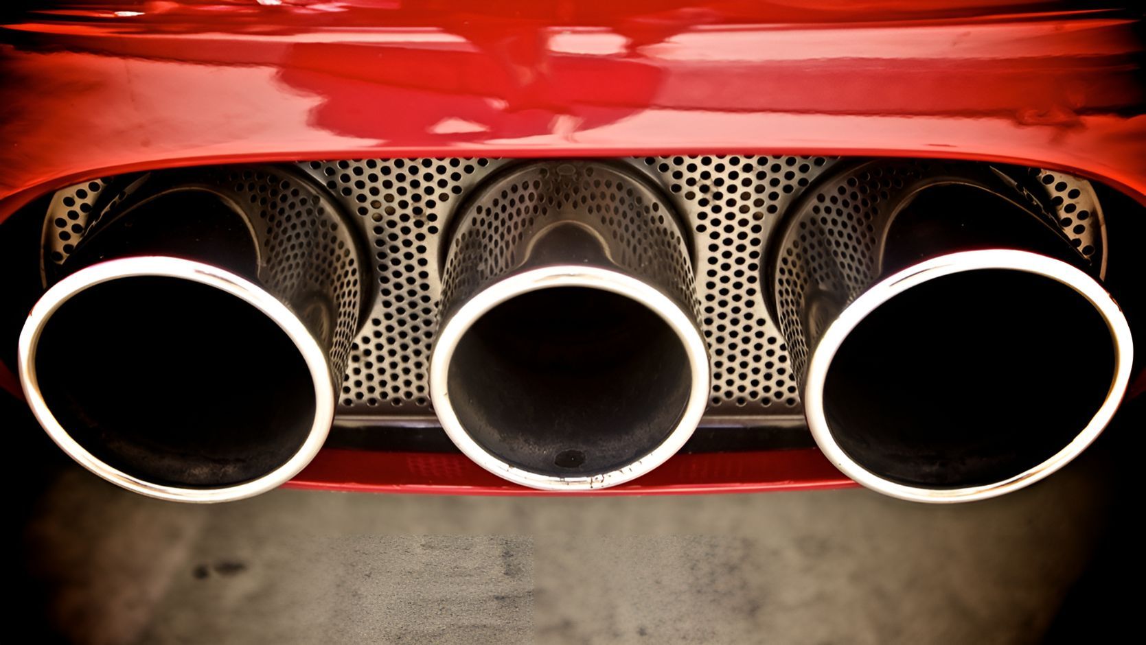 A Close Up of the Exhaust Pipes of a Red Car — K & T Ballina Mechanical In Ballina, NSW