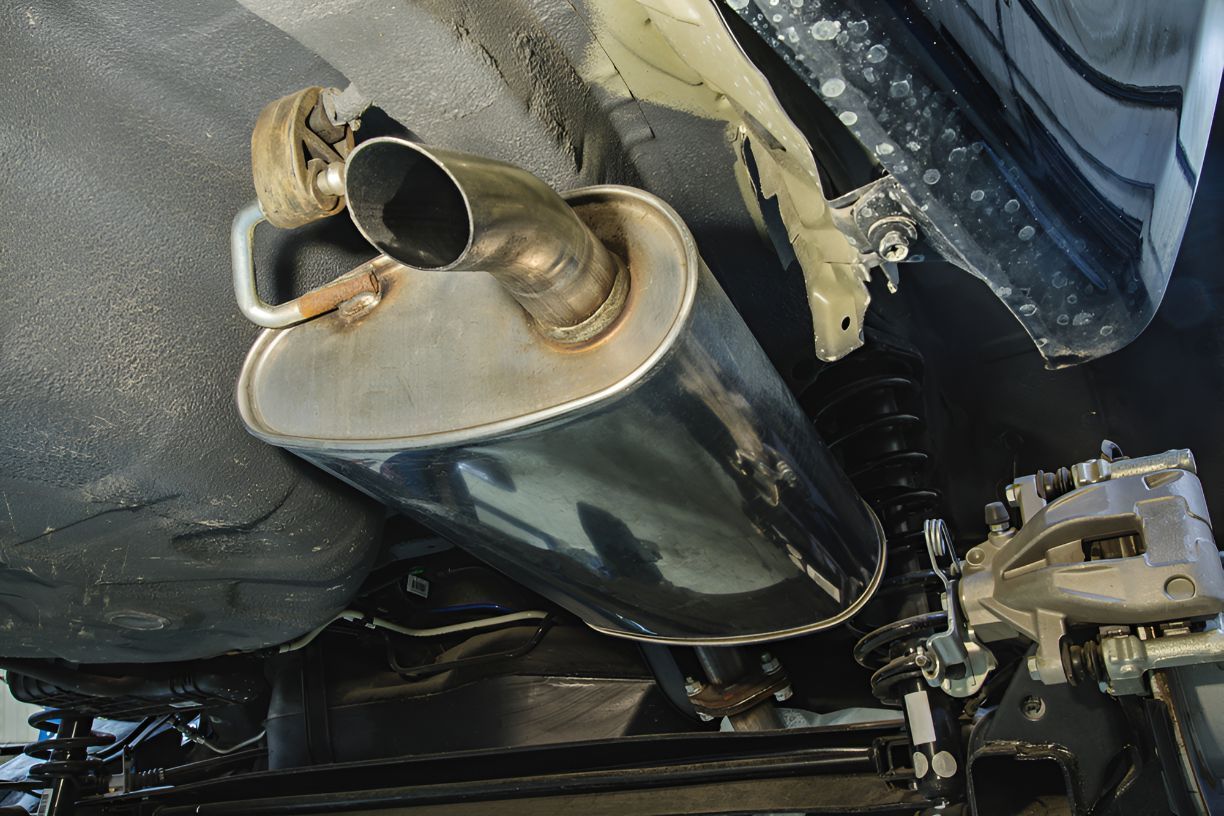 A Close Up of a Exhaust Pipe on the Underside of a Car — K & T Ballina Mechanical In Ballina, NSW