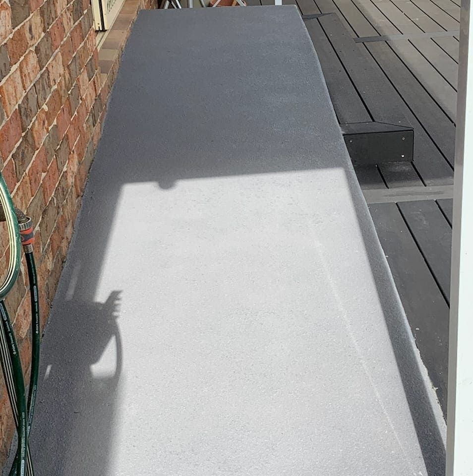 Shadow of an Antenna Cast on a Light Grey Terrace — Brett's Continuous Garden Edges In North Haven, NSW