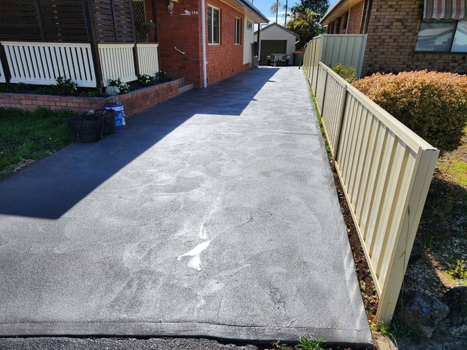 A Newly-paved Concrete Driveway — Brett's Continuous Garden Edges In Lakewood, NSW