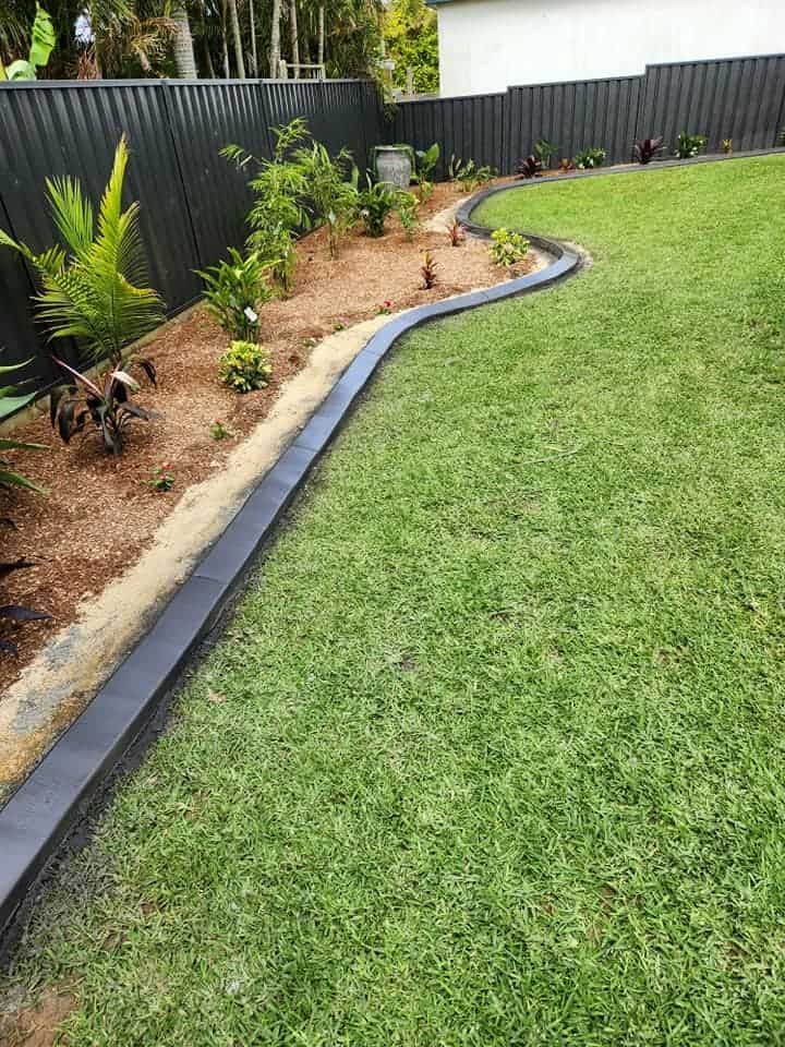 Curved Garden Bed Bordered by a Black Edging — Brett's Continuous Garden Edges In Bonny Hills, NSW