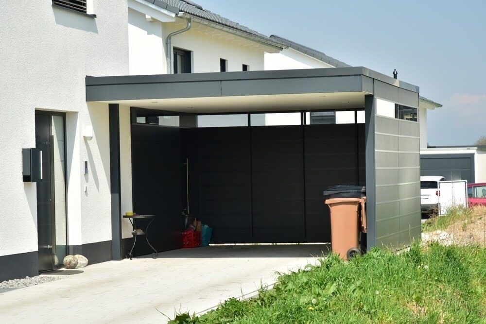 Modern Open Garage With a Flat Roof Attached — Brett's Continuous Garden Edges In Lake Cathie, NSW