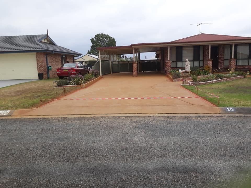 A Freshly Poured Concrete Driveway  — Brett's Continuous Garden Edges In Lakewood, NSW