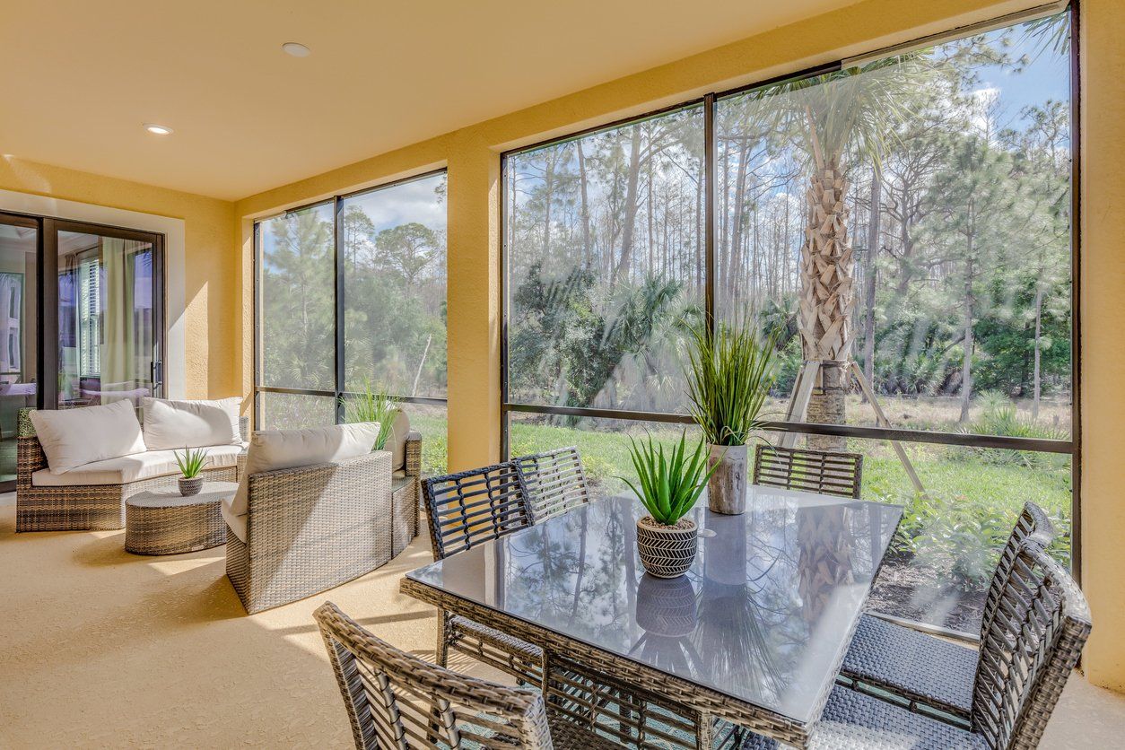 Bright yellow sunroom large enough for entertaining guests