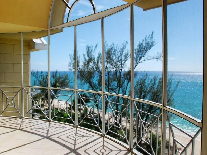 A Glass Railing Is Surrounding A Staircase In A Building — Scratchless Glass Australia in Maroochydore, QLD