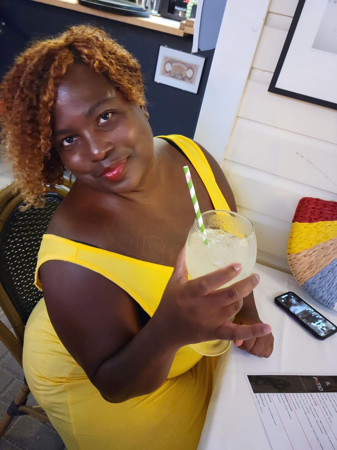Drink That Eat This Travels Kisha Headshot with Cocktail