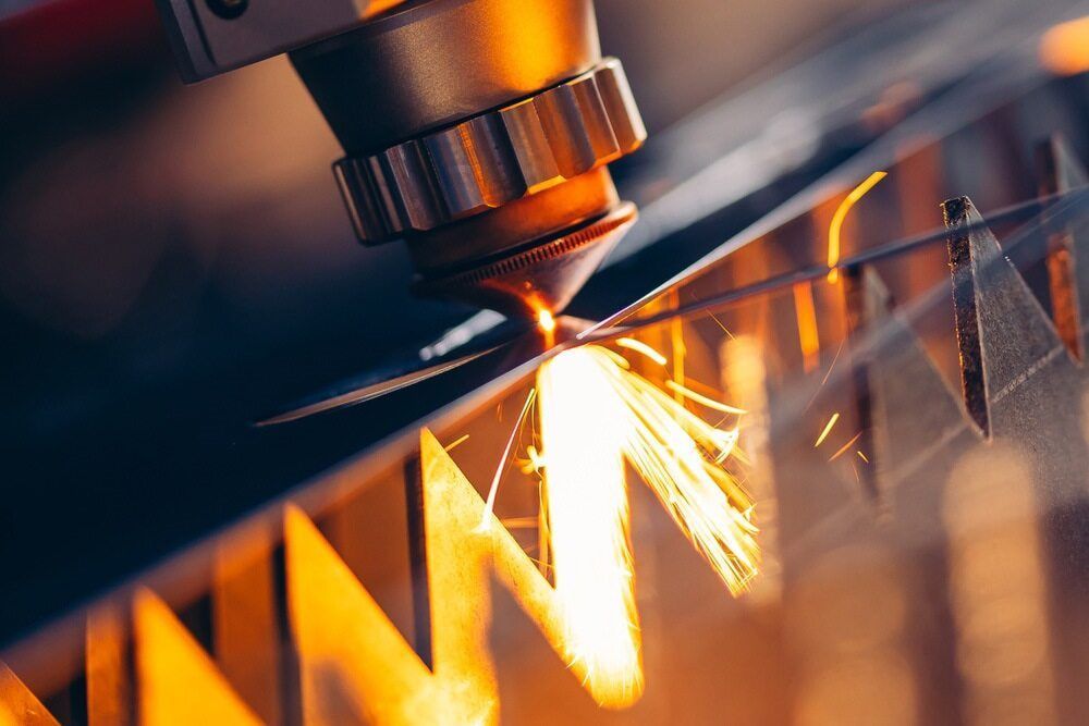 A Machine Is Cutting A Piece Of Metal— Bigdog Welding and Fabrication Pty Ltd In Currajong, QLD