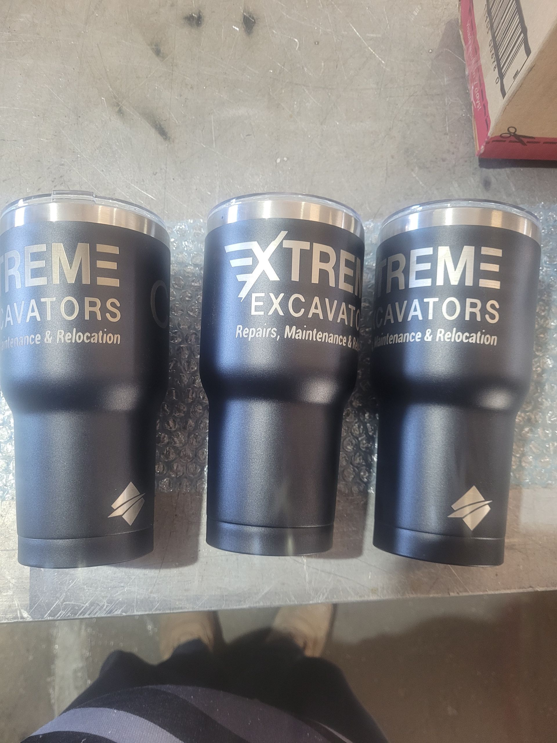 Three Steel Coffee Cups That Say Extreme Excavators Engraved — Bigdog Welding and Fabrication Pty Ltd In Currajong, QLD